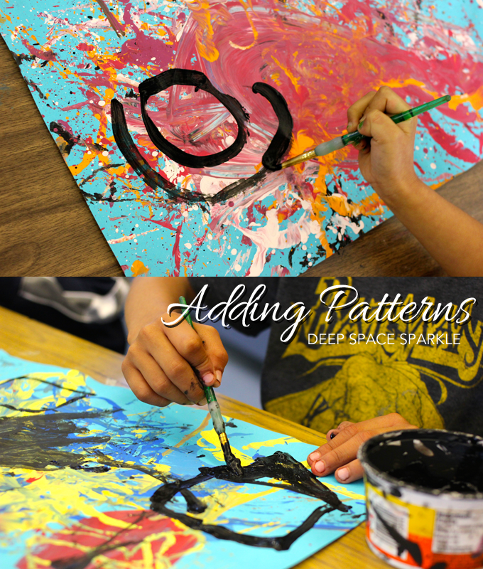 First grade kids study the book, Action Jackson, then create a Pollock Painting using a cool technique.